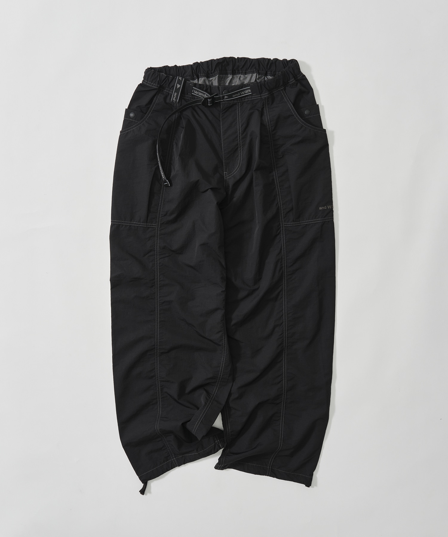 crinkled nylon pants and wander