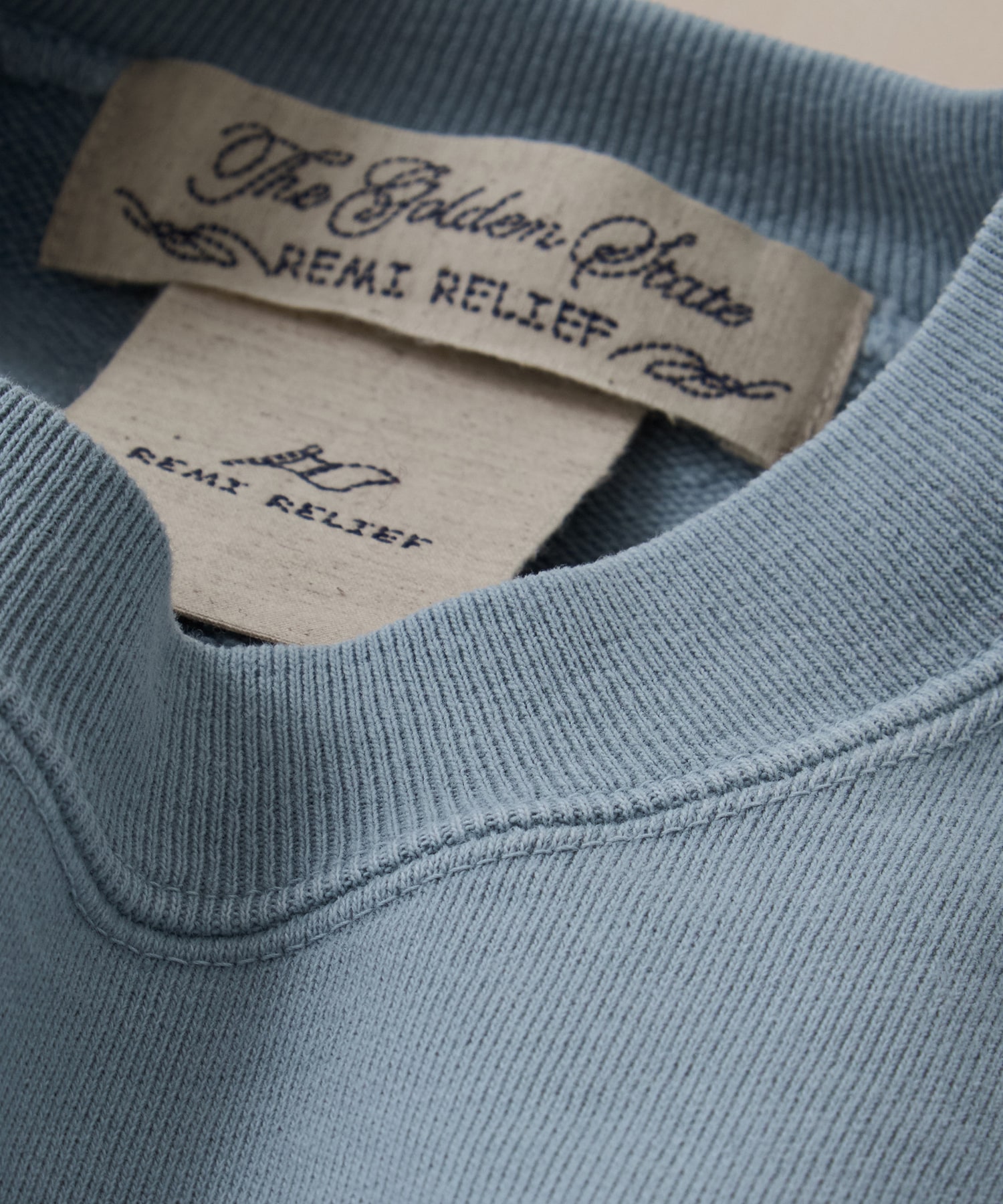 SP加工裏毛BIGサイズクルー REMI RELIEF