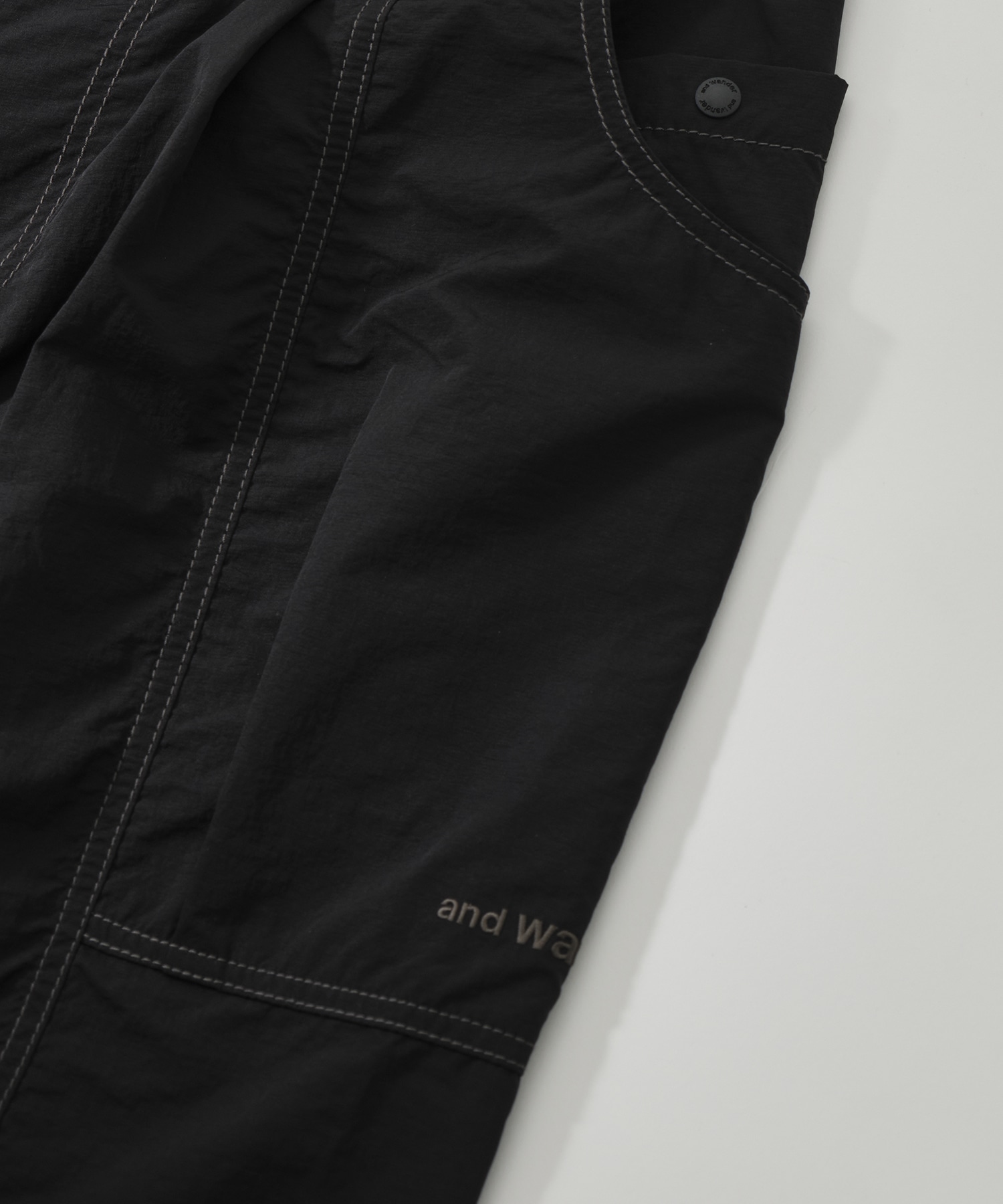 crinkled nylon pants and wander