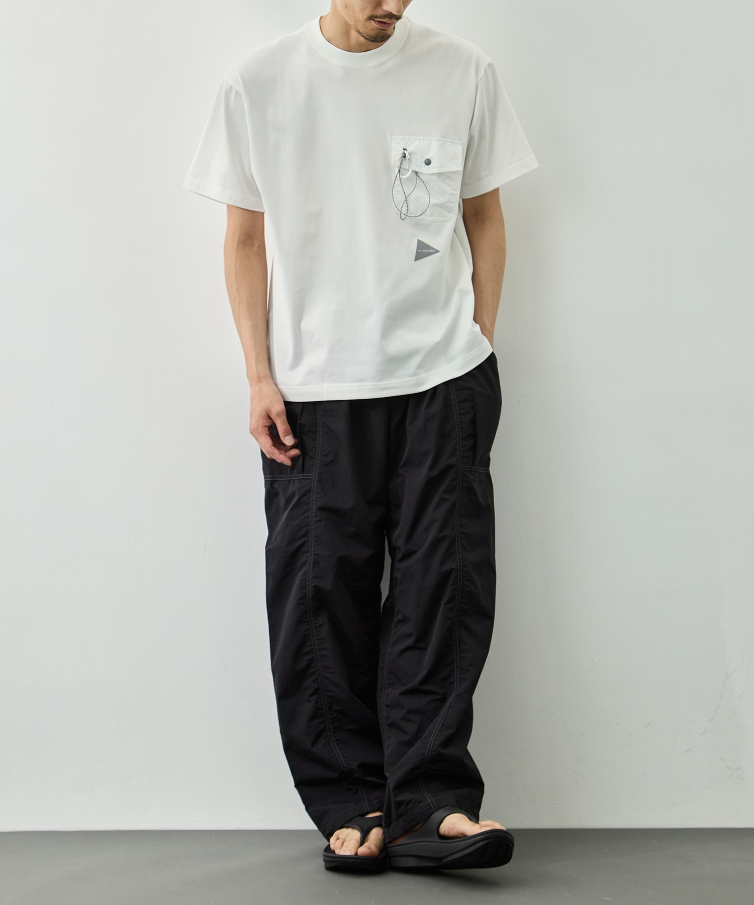 crinkled nylon pants and wander