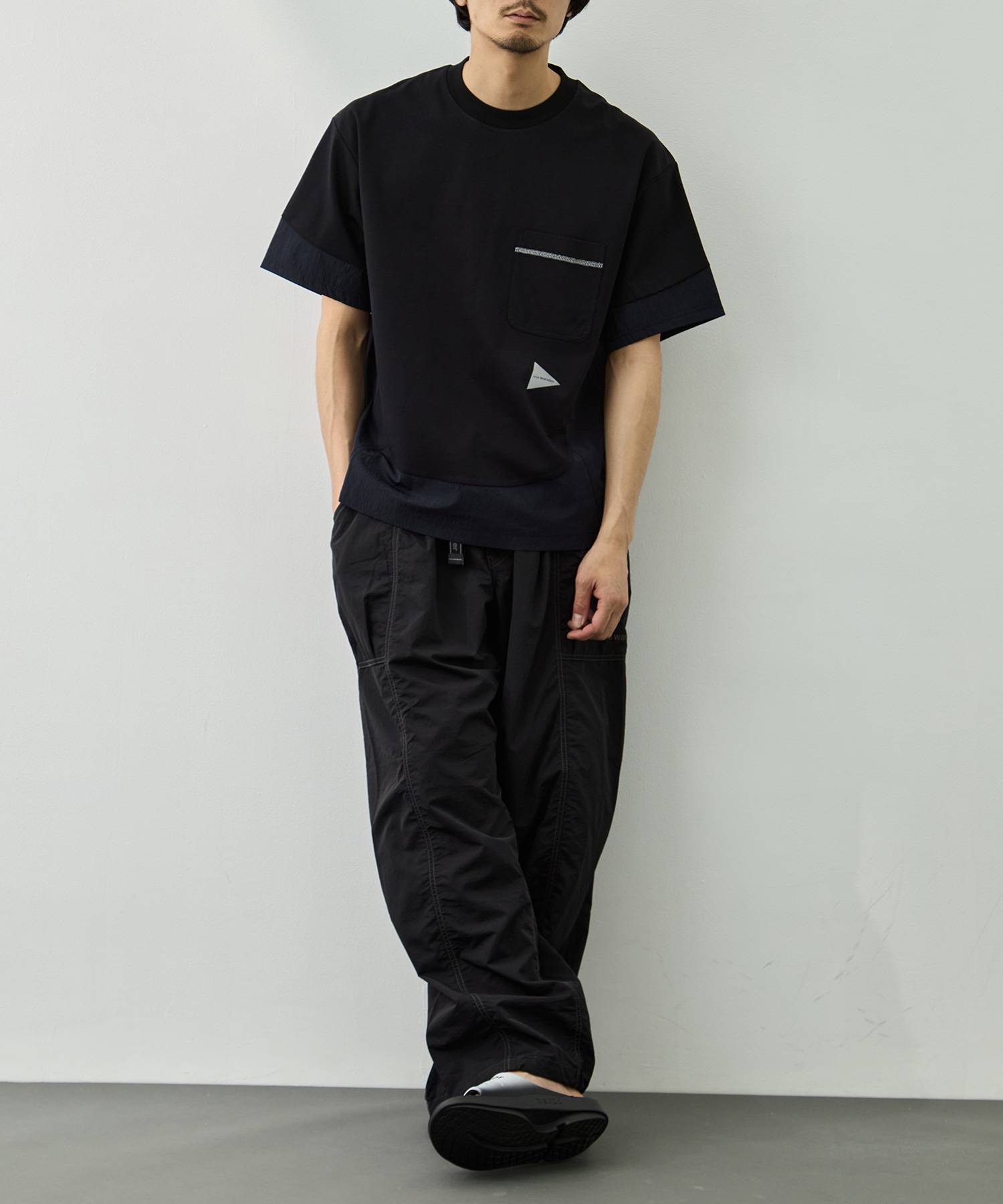 crinkled nylon pants and wander